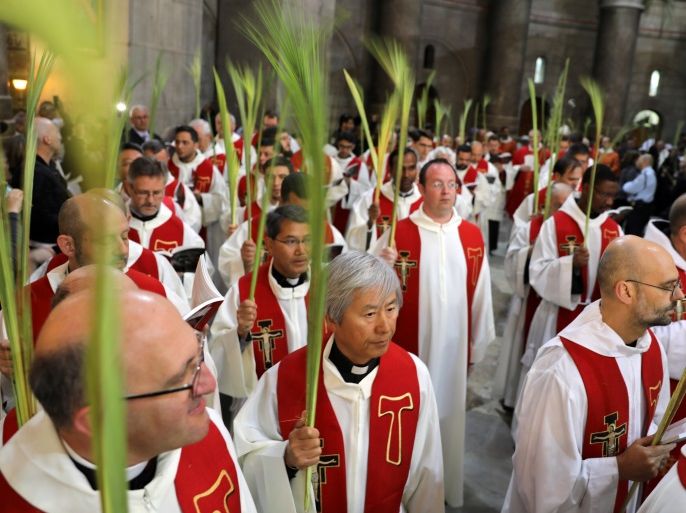 Members of the Catholic Christian clergy take part in a Palm Sunday ceremony in the Church of the Holy Sepulchre in Jerusalem's Old City April 9, 2017. REUTERS/Ammar Awad