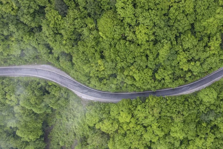 An aerial view of Kastamonu's highway between Inebolu and Cide- - KASTAMONU, TURKEY - MAY 19: A drone photo shows an aerial view of Kastamonu's highway between Inebolu and Cide among the trees in Kastamonu, Turkey on May 19, 2018.