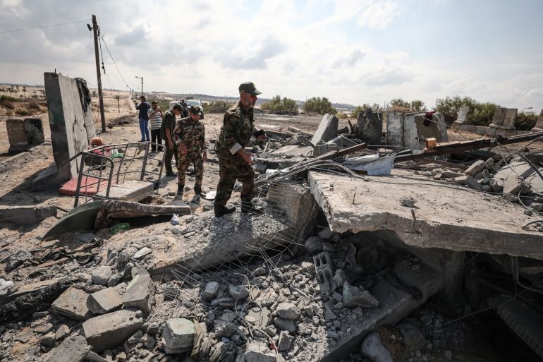 Israeli airstrikes on Gaza- - RAFAH, GAZA - OCTOBER 17: People inspect the damaged buildings after Israeli forces conducted airstrikes in Rafah, Gaza on September 17, 2018.