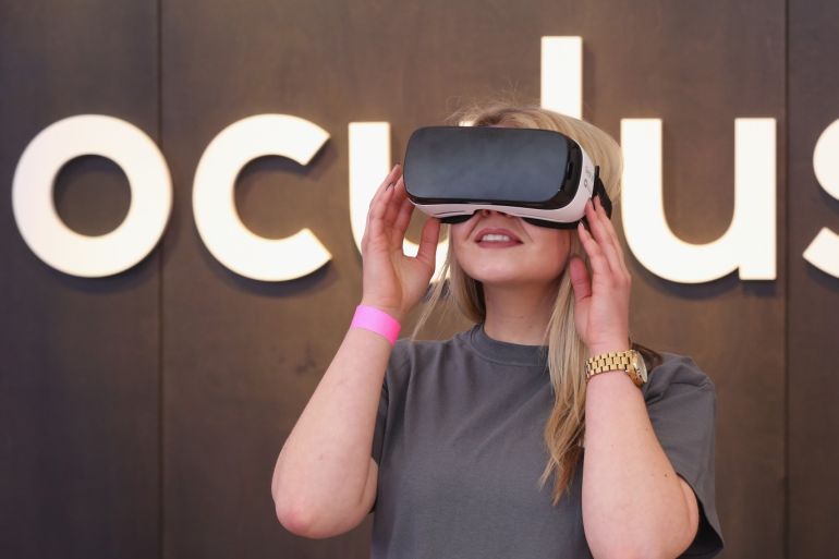 BERLIN, GERMANY - FEBRUARY 24: A Facebook employee demonstrates use of the Oculus Gear VR virtual reality goggles at the Facebook Innovation Hub on February 24, 2016 in Berlin, Germany. The Facebook Innovation Hub is a temporary exhibition space where the company is showcasing some of its newest technologies and projects. (Photo by Sean Gallup/Getty Images)