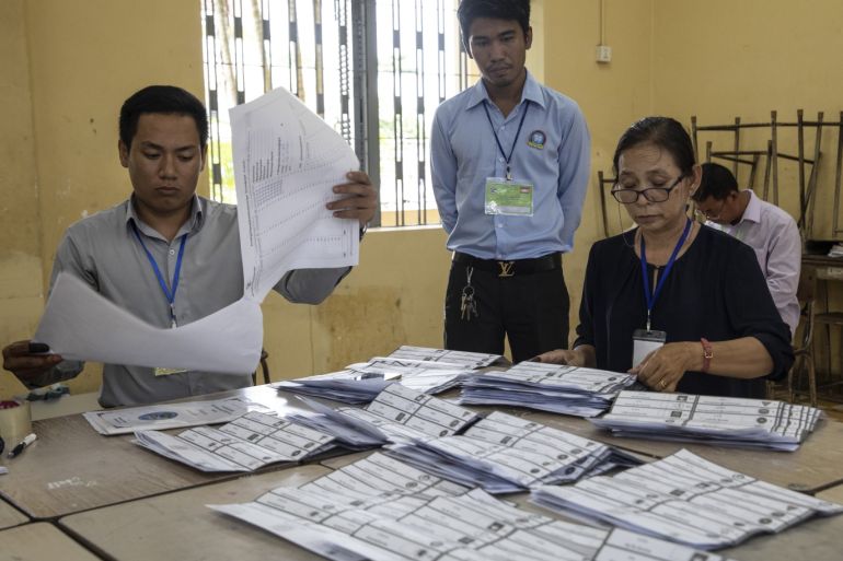 PHNOM PENH, CAMBODIA - JULY 29: Cambodian election workers count ballots after voting finished with an election that has been criticized by the US and the EU on July 29, 2018 in Phnom Penh, Cambodia. The opposition party, the Cambodia National Rescue Party has been dissolved. Some politicians who were the only serious challengers to Prime Minister Hun Sen, in power since 1985, were jailed. (Photo by Paula Bronstein/Getty Images)