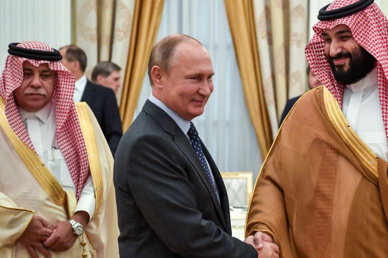 Russian President Vladimir Putin shakes hands with Saudi Crown Prince Mohammed bin Salman during their meeting at the Kremlin in Moscow, Russia June 14, 2018. Yuri Kadobnov/Pool via REUTERS