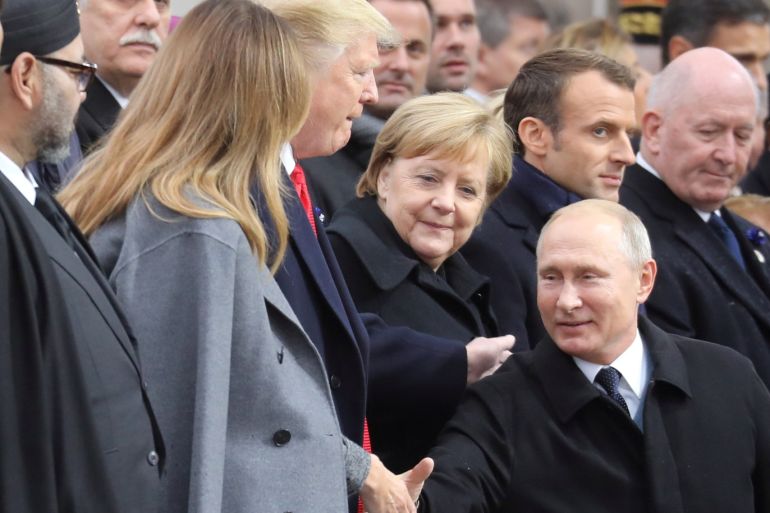 Russian President Vladimir Putin shakes hands with U.S. First Lady Melania Trump, next to U.S. President Donald Trump and German Chancellor Angela Merkel as he arrives to attend a commemoration ceremony for Armistice Day, 100 years after the end of the First World War at the Arc de Triomphe, in Paris, France, November 11, 2018. Ludovic Marin/Pool via REUTERS