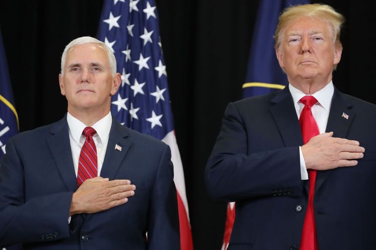 LANGLEY, VA - MAY 21: U.S. President Donald Trump (R) and Vice President Mike Pence participate in the swearing-in ceremony for Gina Haspel to be CIA director at agency headquarters, May 21, 2018 in Langley, Virginia. Last week the Senate confirmed Haspel to replaced Mike Pompeo who was sworn in as Secretary of State earlier this month. Mark Wilson/Getty Images/AFP== FOR NEWSPAPERS, INTERNET, TELCOS & TELEVISION USE ONLY ==