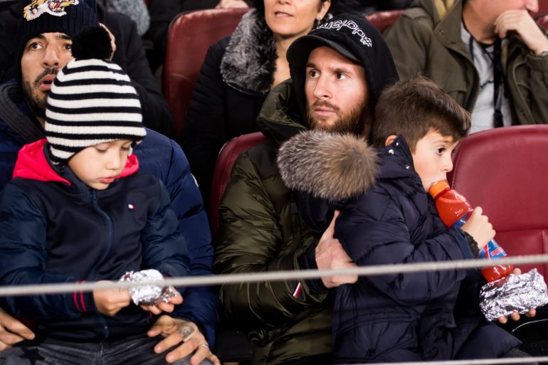 BARCELONA, SPAIN - DECEMBER 05: Lionel Messi and Luis Suarez of FC Barcelona sit in the stand with their sons during the Copa del Rey fourth round second leg match between FC Barcelona and Cultural Leonesa at Camp Nou on December 05, 2018 in Barcelona, Spain. (Photo by Alex Caparros/Getty Images)