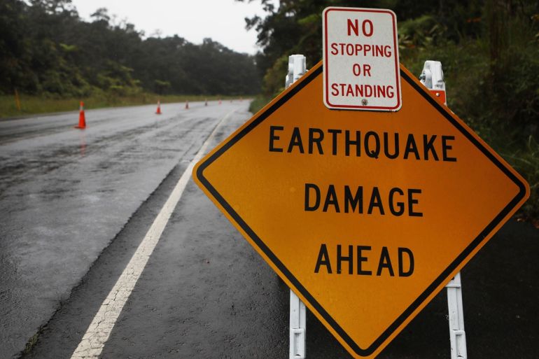 HAWAII VOLCANOES NATIONAL PARK, HI - MAY 17: A sign is posted warning of earthquake damage to the road from seismic activity at the Kilauea volcano on Hawaii's Big Island on May 17, 2018 in Hawaii Volcanoes National Park, Hawaii. The U.S. Geological Survey said the volcano erupted explosively in the early morning hours today launching a plume about 30,000 feet into the sky. Mario Tama/Getty Images/AFP== FOR NEWSPAPERS, INTERNET, TELCOS & TELEVISION USE ONLY ==