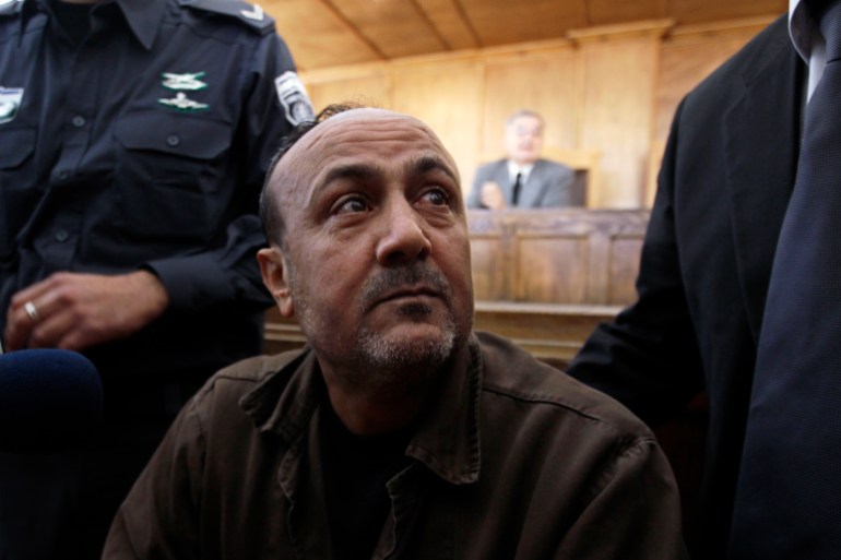 Jailed Fatah leader Marwan Barghouti attends a deliberation at Jerusalem Magistrate's court January 25, 2012. Convicted of murder for his role in attacks on Israelis, Barghouti was jailed for life by Israel in 2004. REUTERS/Ammar Awad (JERUSALEM - Tags: POLITICS CRIME LAW)
