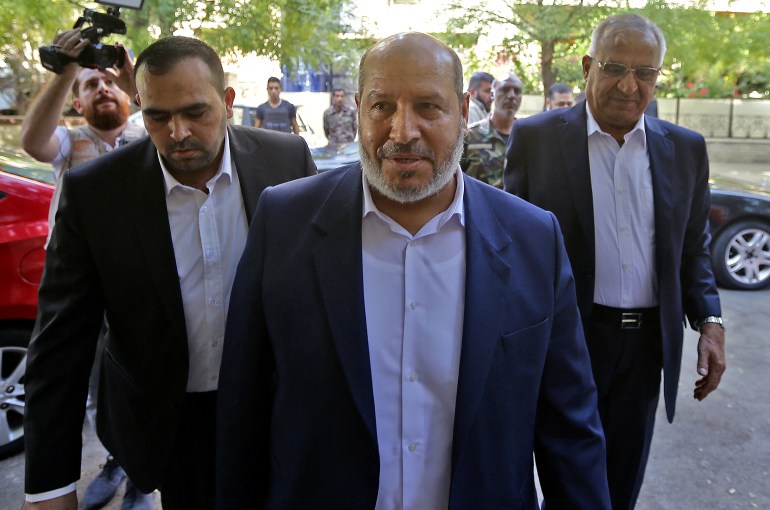 Hamas's chief representative in Lebanon Osama Hamdan (L), Hamas arab relations chief Khalil al-Hayya (C), secretary general of the Popular Front for the Liberation of Palestine-General Command, Talal Naji, arrive for a press conference during a visit to the Syrian capital Damascus on October 19, 2022 for the first time since the Palestinian Islamist group severed ties with Syria a decade ago. Palestinian movement Hamas said it restored relations with the Damascus government after a visiting delegation held a "historic meeting" with President Bashar al-Assad in Syria's capital. The group, which controls the Gaza Strip, was one of Assad's closest allies but it left Syria in 2012 after condemning his government's brutal suppression of protests in March 2011, which triggered the country's descent into civil war. (Photo by Louai Beshara / AFP)