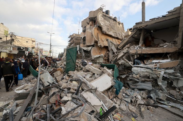 Palestinians inspect the debris of a house destroyed by Israeli bombing in Rafah in the southern Gaza Strip on March 4, 2024, amid the ongoing conflict between Israel and the Palestinian militant group Hamas. (Photo by MOHAMMED ABED / AFP)