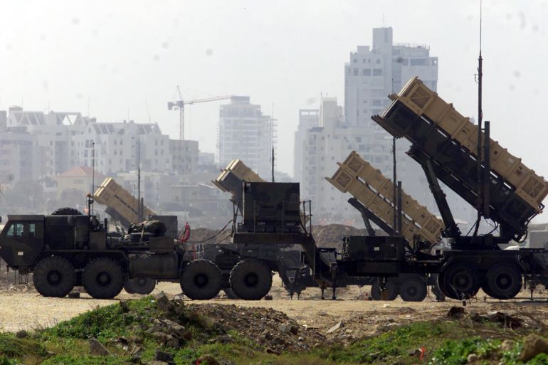 U.S. Patriot anti-missile batteries stand behind razor wire near Jaffa, a coastal port near Tel Aviv, on March 4, 2003. The U.S.-built Patriots, which are designed to shoot down missiles in mid-air, will be used to protect Israel from any missile attack in the event of a U.S.-led military strike on Iraq. REUTERS/Havakuk Levison