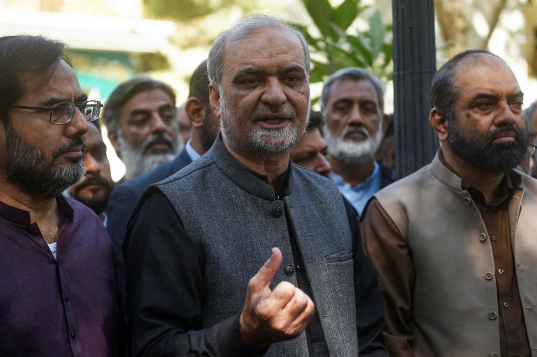 Hafiz Naeem Ur Rehman (C), Karachi Chief of Islamist party Jamaat-e-Islami (JI) speaks to the media after submitting nomination papers at the deputy commissioner office in Karachi on December 22, 2023, ahead of the upcoming 2024 general elections. (Photo by Rizwan TABASSUM / AFP)