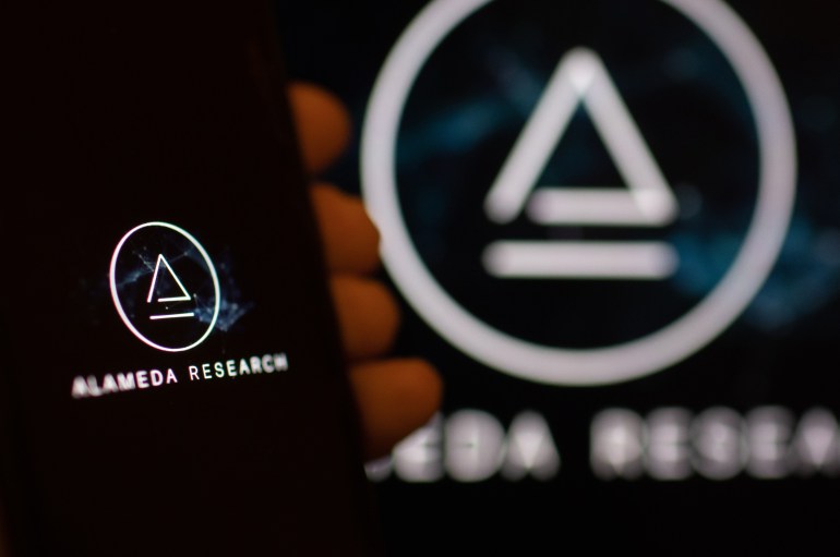 The logo of Alameda Research LLC on digital devices arranged in Riga, Latvia, on Tuesday, Nov. 22, 2022. Alameda, which Sam Bankman-Fried, launched prior to co-founding FTX, has been credited with helping to propel the crypto billionaire to international fame and success. Photographer: Andrey Rudakov/Bloomberg via Getty Images