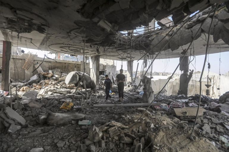Palestinians stand in the ruins of the Chahine family home, after an overnight Israeli strike that k https://thefederal.com/category/international/hamas-to-send-delegation-to-egypt-for-further-cease-fire-talks-in-new-sign-of-progress-120772