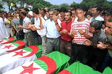 Algerians mourn over the coffins of six young people killed in a suspected Islamic rebel attack in western Algiers, during a funeral