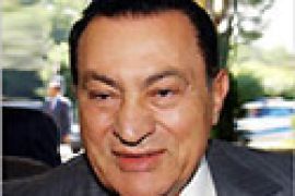 r - Egyptian President Hosni Mubarak arrives at the Hotel Intercontinental in Geneva, July 19, 2002. Mubarak surprisingly arrived