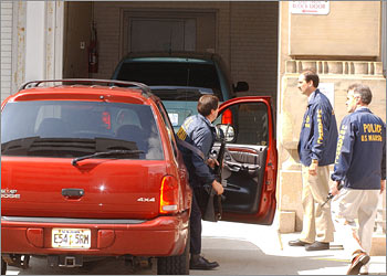 Various law enforcement agencies bring in the sixth man to be arraigned under heavy security at the Federal Court in Buffalo, New York, September 16, 2002. A sixth U.S. citizen of Yemeni descent was charged on Monday with providing "material support" to al Qaeda, the militant Islamic network that the United States blames for the Sept. 11 attacks. Although investigators said the man, and five others arrested over the weekend in western New York state, had no direct connection to the four hijacked plane strikes, they alleged that the six were trained to use assault rifles and other weapons in an al Qaeda-run camp in Afghanistan. REUTERS