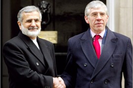 Britain's Foreign Secretary Jack Straw (R) greets Iran's Foreign Minister Kamal Kharrazi on the steps of Downing Street, London, February 6, 2003. Iran said on Wednesday that any military action to disarm neighbouring Iraq must be launched by the United Nations and warned that a U.S.-led war on Baghdad could trigger a "clash of civilisation". REUTERS/Toby Melville