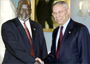 US Secretary of State Colin Powell (R) shakes hands with Sudanese rebel leader Dr. John Garang, during a brief photo opportunity in the Treaty Room of the US State Department, 28 May 2003 in Washington, DC. AFP PHOTO/Paul J. RICHARDS