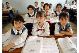 f - Pupils participate in class at the Al-Eshterakiah primary girl school, in the impoverished Shiite suburb of Sadr City, formerly known as Saddam City, during the