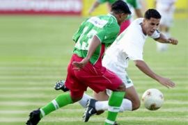 f: Ahmad al-Atlasi (L) of Morocco's al-Raja al-Baidhawi club fights for the ball against Saleh Bashit al-Dusari of Saudi Arabia's al-Ittifaq club during their Arab Champions Cup match in Cairo 14 July 2003. Al-Ittifaq won 2-0.