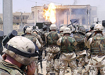 f: This photo released by the US Defense Department (DOD) 23 July, 2003, shows flames erupting from a building hit with a TOW missile launched by soldiers of the Army's 101st Airborne Division (Air Assault) on 22 July, 2003, in Mosul, Iraq. The sons of deposed Iraqi President Saddam Hussein, Qusay and Uday, who were believed in the building, were reportedly killed in the gun battle. "We have no doubt we have the bodies of Uday and Qusay," Lieutenant General Ricardo Sanchez told journalists in Baghdad, 23 July.