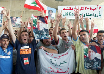 Followers of exiled Lebanese General Michel Aoun stage a demonstration near the Beirut courthouse 09 August 2003 to mark the second anniversary of the August 2001 unrest, which followed a wave of arrests by Lebanese security forces of anti-Syrian Christians