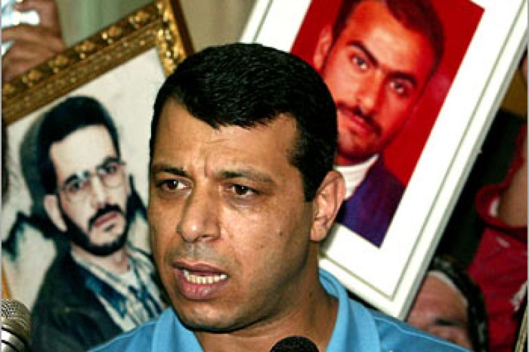 f: Palestinian Security Chief Mohammed Dahlan talks to the press after meeting the relatives of Palestinian prisoners held in Israeli jails, 16 August 2003 in the West Bank city of Ramallah. Israel has freed only a few hundred of the estimated 6,000 prisoners, despite the militants' demand for all to be released in return for the three-month truce they declared on June 29.