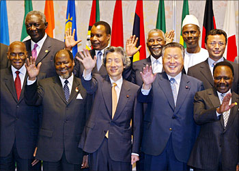 Japanese Prime Minister Junichiro Koizumi (front/C), former Prime Minister Yoshiro Mori (front/2nd R) and African leaders wave to photographers during a photo session in the Third Tokyo International Conference on African Development (TICAD III) in Tokyo, 29 September 2003. Front row L-R: President of Senegal Abdoulaye Wade, President of Mozambique Joaqium Alberto Chissano, Koizumi, Mori and President of Gabon El Hadj Omar Bongo. 2nd row L-R: President of Ghana John Agyekum Kufuor, President of Congo Republic Denis Sassou-Nguesso, President of South Africa Thabo Mvuyelwa Mbeki, Guinean Prime Minister Lamine Sidime and President of Madagascar Marc Ravalomonana