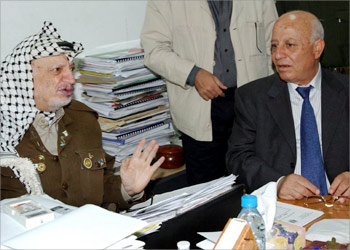 Palestinian leader Yasser Arafat (L) and Parliament speaker and nominee for prime minister Ahmed Qurie meet at Arafat's office in the West Bank town of Ramallah September 11, 2003. Israel's foreign minister said its security cabinet, summoned for an emergency session on Thursday after two suicide bombings, should ignore U.S. objections and expel Palestinian President Yasser Arafat. REUTERS/Omar Rashidi/Palestinian Authority