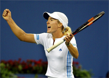 Justine Henin-Hardenne of Belgium celebrates a point against Jennifer Capriati of the Unted States during their semi-final match at the 2003 US Open tennis championships at Flushing Meadows in New York, 05 September 2003.