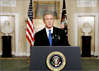U.S. President George W. Bush poses moments after his televised address to the nation in the Cabinet Room of the White House, September 7, 2003. Bush, facing growing doubts at home, asked Congress on Sunday night for $87 billion for the U.S. military deployment and reconstruction in Iraq and asked the United Nations to set pass differences aside and help out. REUTERS/Larry Downing