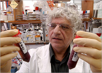 f: Professor Zvi Livneh shows a blood test at the Weizman institute of science in the central Israeli town of Rehovot 04 September 2003. Researchers in Israel have developed a new blood test which can identify smokers who are at a greater risk of developing lung cancer. Research carried out at the Weizman Institute has uncovered a new genetic "marker" or risk factor among certain smokers which can be quickly identified by means of a simple blood test.