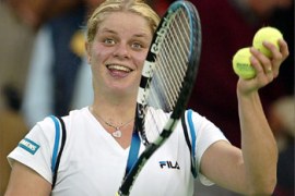 Kim Clijsters of Belgium is all smiles after defeating France's Amelie Mauresmo in their quarter final match at the Porsche Tennis Grand Prix in Filderstadt, south, 10 October 2003. Clijsters won in two sets 6-4, 6-3