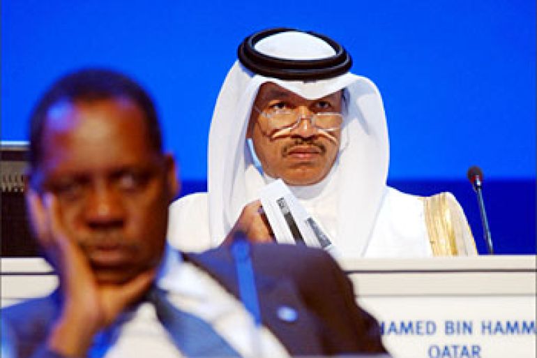 The Asian Football Confederation (AFC) President Mohammed Bin Hammam (R) listen along with the chief of the African Football Federation Issa Hayato (L) during the extraordinary congress of the Asian Football Confederation (AFC) in Doha 19 October 2003. AFP PHOTO/Fadi HAJJ