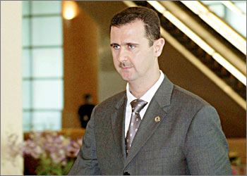 Syrian President Bashar Al-Assad arrives for a meeting of the 10th Organization of Islamic Conference (OIC) Summit in Putrajaya near Kuala Lumpur October 17, 2003. Muslim leaders winding up a summit on Friday were set to criticise a U.S. Congress vote to impose trade sactions on Syria, a move host Malaysia says set "a very dangerous precedent". REUTERS/Zainal Abd Halim