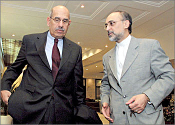 Iran's ambassador to the IAEA Ali Akbar Salehi (R) talks with U.N. nuclear watchdog chief Mohamed Elbaradei at a hotel in Tehran October 17, 2003. The U.N. nuclear watchdog chief said on Thursday Iran had vowed to answer outstanding concerns about its nuclear programme and was willing to accept tougher inspections of sites, where Washington says bombs could be made. REUTERS/Morteza Nikoubazl