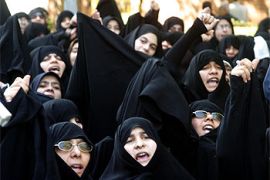 f: Hundreds of female Islamic hardliners hold an angry protest after weekly Muslim prayers at Tehran University