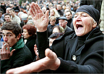A Georgian protester shouts during an opposition rally in Tbilisi, November 13, 2003. The opposition launched round-the-clock protests after the November 2 parliamentary poll, and says it wants more than an acknowlegment from the Georgian President Eduard Shevardnadze that the vote was rigged. REUTERS/Gleb Garanich