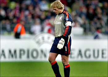 Oliver Kahn of FC Bayern Munich leaves the field after the Champions League Group A soccer match against Olympique Lyon in Munich's olympic stadium November 5, 2003. Lyon won the match 2-1. REUTERS/Michael Dalder