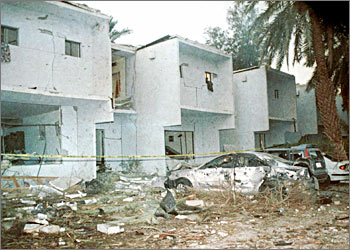 A picture shows 09 November 2003 the bombed-out al-Muhaya expatriate housing compound in the Wadi Laban suburb, west of Riyadh, after a stolen police jeep laden with explosives penetrated the fortified compound and blew up inside late 08 November killing at least five and wounding some 100. The atrocity came the same day the United States closed its missions in Saudi Arabia for a security review after warning of possible attacks, amid celebrations for the holy month of Ramadan. A Saudi official told AFP that Saturday night's carnage bore the hallmarks of the al-Qaeda network headed by Saudi-born Osama bin Laden. AFP PHOTO/Bilal QABALAN