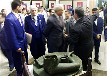 F_Iraqis visit Baghdad's National Museum 11 November 2003, where two sculptures (one of them in the picture -C) that were looted following the fall of the Iraqi regime in April were displayed. The major artifacts missing since the looting of Baghdad's museum were found in a cesspool during a raid on a house in the Iraqi capital, a coalition spokesman said last week. He described the items as a statue dating back to 2300 years before Christ and a brazier from 850 BC, both among the 30 priceless missing items cited in a report early September in a US investigation of the looting of the National Museum of Iraq. AFP PHOTO/SABAH ARAR