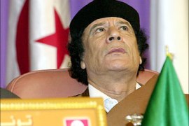 Libyan leadr Moamer Khadafi looks on on 06 December 2003 in Tunis during the closure of a summit of five southern European countries and five north African nations, devoted to regional cooperation.