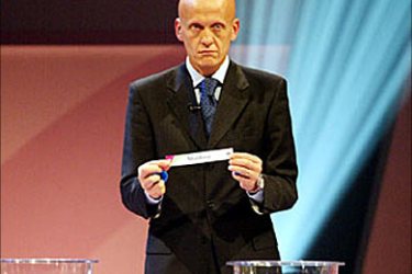 F_Italian referee Pierluigi Collina, makes a draw for the European countries of the preliminary round of the 2006 World Cup in Germany. AFP PHOTO FRANCK FIFE