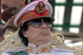 (F_FILES) this file picture taken 07 September 1999 shows Libyan leader Moamer Kadhafi attending a five-hour military parade in Tripolito mark the 30th anniversary of the Libyan Revolution that brought him to power. The United States and Britain said 19 December 2003 that Libya, long a pariah on the world stage, has acknowledged attempts to develop weapons of mass destruction and pledged to renounce them. AFP PHOTO/FILES/MARWAN NAAMANI