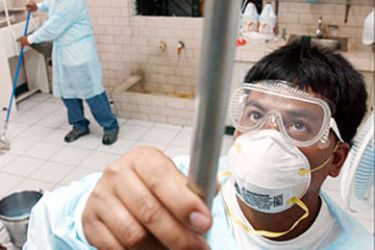 F_Hospital personnel of the Laguna Provincial Hospital in Santa Cruz town wear protective suits and