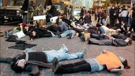 Human rights activists lie on the floor to simulate death near parliament in downtown Beirut 16 January 2004, to protest the execution of three men at dawn 17 January 2004. The London-based rights group Amnesty International, The European Union and France have called on President Emile Lahoud to immediately halt the executions which will be the first since May 1998. AFP PHOTO/Joseph BARRAK