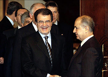 European Commission president Romano Prodi (L) shakes hand with Turkish President Ahmet Necdet Sezer at the presidency residence minutes before their bilateral meeting in capital Ankara, 16 January 2004. Prodi said yesterday that Turkey should fully implement the democracy reforms it has adopted and help resolve the decades-old division of Cyprus in order to advance its struggling bid to join the European Union