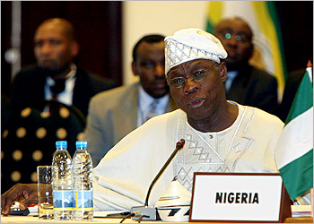 Nigerian President Olusegun Obasanjo addresses African leaders and the media at the New Partnership for Africas Development summit (NEPAD) in Rwandas capital, Kigali, February 14, 2004. African leaders trying to fight poverty through better governance said on Saturday they planned peer reviews of 16 nations by March 2006 to try to boost the reputation of a continent known more for conflict and disease. REUTERS/Antony Njuguna