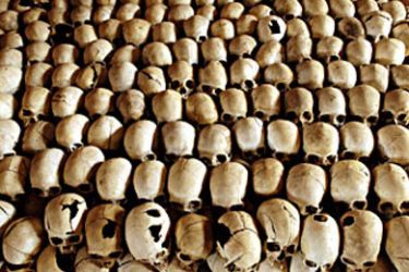 Skulls of victims of the Ntarama massacre during the 1994 genocide are lined in the Genocide Memorial Site church of Ntarama, in Nyamata 27 February 2004. In the Bugesera province, where the small town of Nyamata is located, the 1994 Rwandan genocide was particularly brutal. Among the 59.000 Tutsis who lived in the province, 50.000 were killed during the genocide, and among them 10.000 were slain in the church. AFP PHOTO/GIANLUIGI GUERCIA