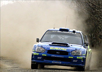 F_Norwegian driver Petter Solberg drives his Subaru during the first leg of the Mexico rally, new to the FIA world championship circuit, in Leon, Mexico, March 12, 2004. REUTERS/Henry romero